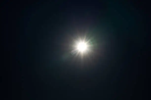 Photo of Real lens flare isolated on black background