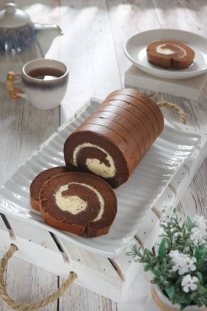 istock close up, Chocolate roll cake served on a white tray 1456578129