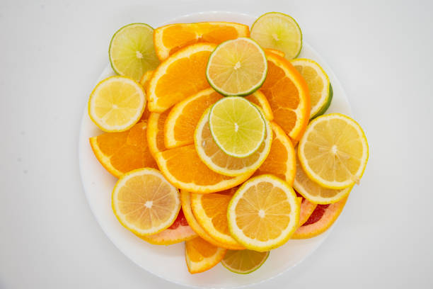 bowl of healthy fresh fruit salad on a white background. Top view with copy space. Lying flat