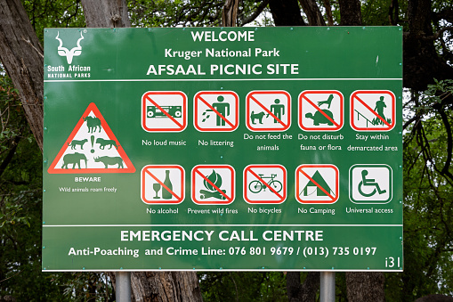 Afsaal Picnic Site, Kruger Park, South Africa - December 4th 2022: Sign with rules and regulations for the picnic site in the center of the national park