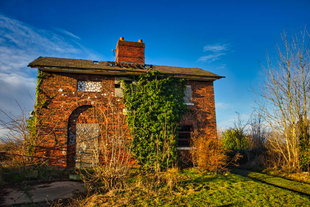 Beautiful old abandoned building farm house in countryside on natural background, photography consisting of old abandoned building farm house at wild grass, old abandoned building farm house over sky