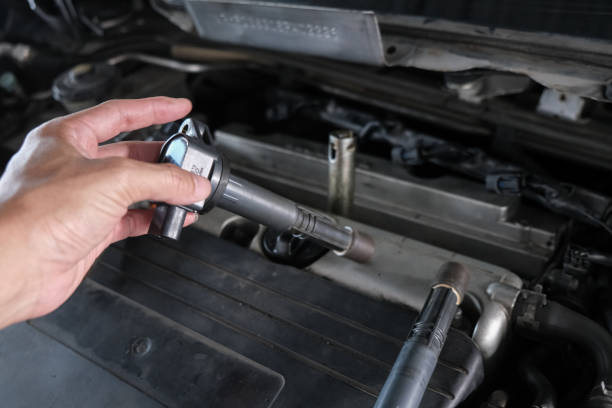 istock Mechanical man hand checking and change ignition coil with spark plug of car engine 1456579893