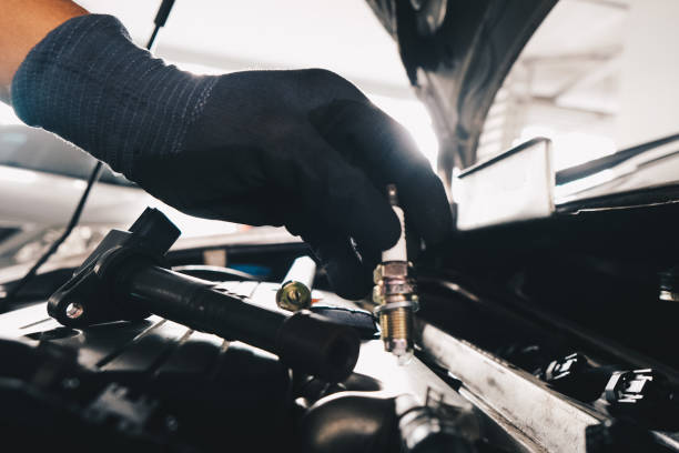 istock Mechanical man hand checking and change ignition coil with spark plug of car engine 1456580818