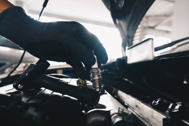 istock Mechanical man hand checking and change ignition coil with spark plug of car engine 1456580844