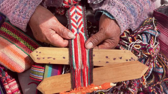 Peruvian woman weaving. Cusco, Peru
