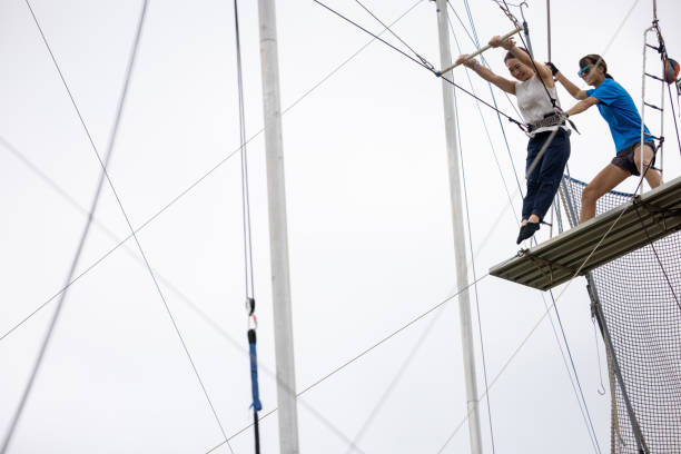 istock Young woman started flying from the jumping ramp 1456581596