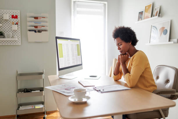 istock Businesswoman having headache at office 1456581683