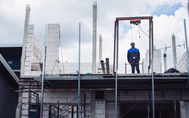 istock Lanscape of house, building, condominium construction structure wih worker or civil engineer standing in outdoor site. Real Estate Investment, Architecture Concept. 1456582488