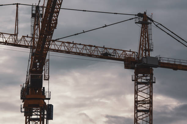 istock Low angle view of cranes against sky 1456588010