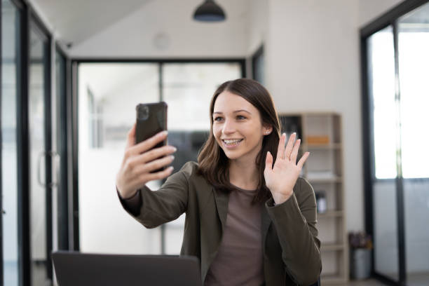 istock Caucasian woman talk on cell using voice assistant. 1456588172