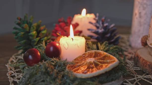 istock Advent Christmas Table Handmade Decorations with Pine Cones Candles Dried Fruit and Coniferous Tree Twig 1456588180