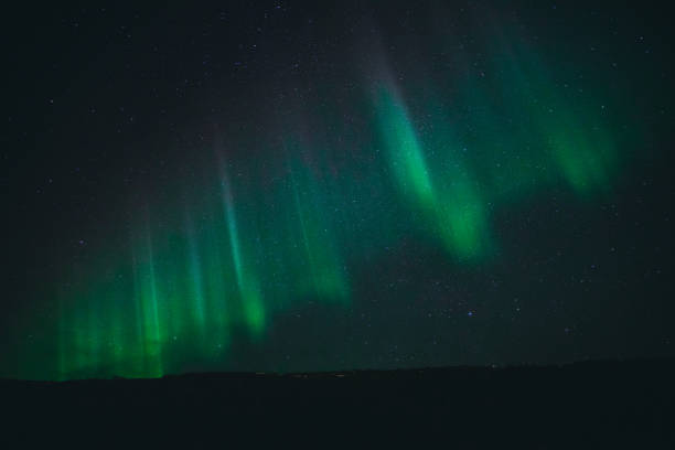 istock Strong Aurora Borealis over the mountains of Norway 1456588250