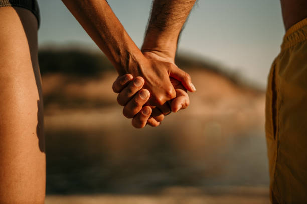 istock Grab my hand and jump off a cliff into the sea 1456591447