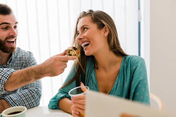 istock Happy couple enjoying breakfast together 1456592888