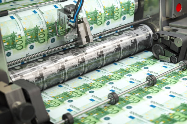 Printing money euro bills on a print machine in typography.. Finance, tax, stock market and investment, making money concept. stock photo