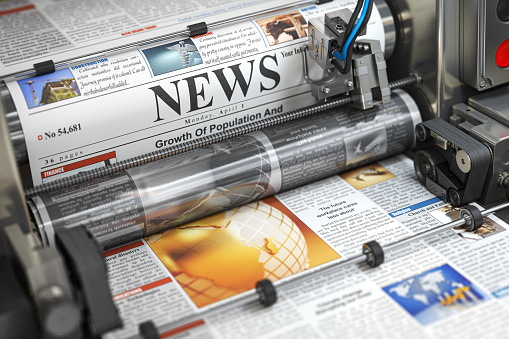 Newspaper or hournal with news printing on a printing machine in a typography.  3d illustration
