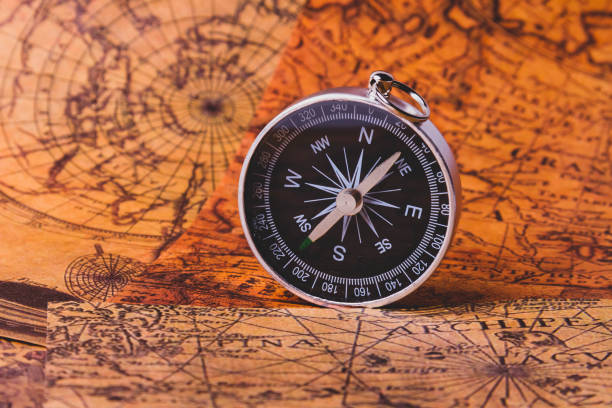 istock Looking for adventure. Compass and maps. Treasure map and path to the treasure. 1456597107