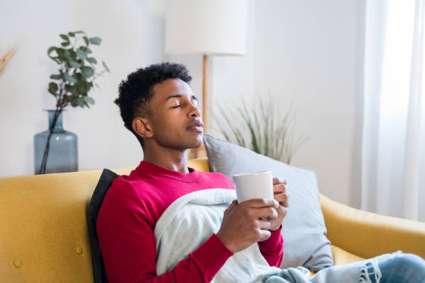 istock Black man with cup of hot drink 1456600440