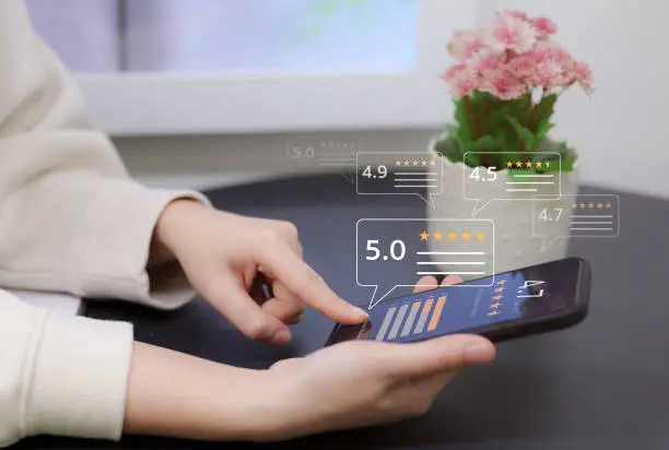 Photo of User comment and give excellent rating to service experience on online application, User evaluate quality of service reputation ranking of business. Customer satisfaction feedback survey concept.