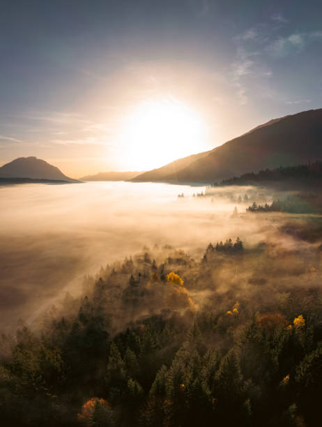istock Moody mysterious sunrise landscape and clouds during autumn 1456603163