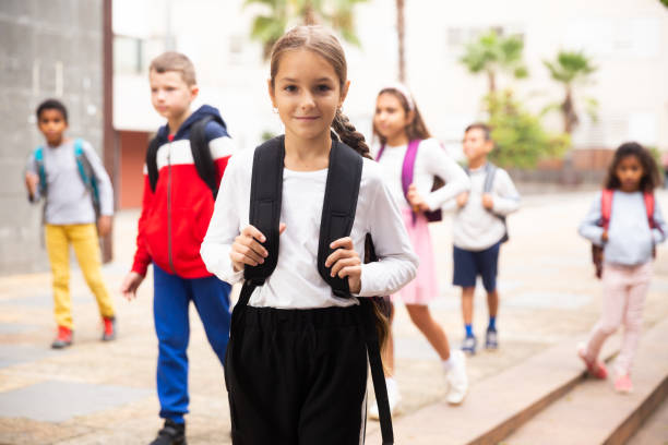 istock Tweenager girl with backpack walking after lessons 1456603329