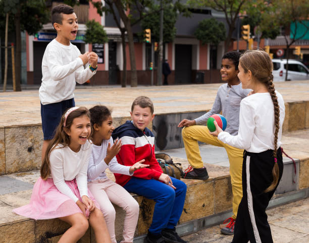 istock Children during conversation  sitting on stairs outdoors 1456603540