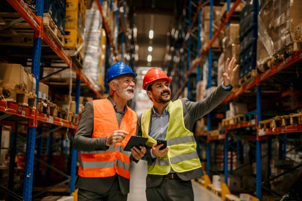 istock Business partners walking in storage 1456604976