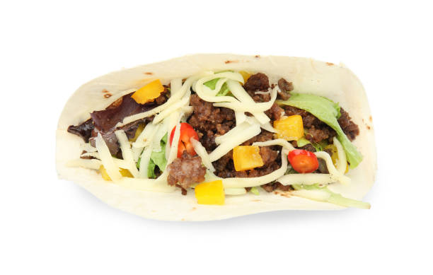 istock Delicious taco with fried meat, vegetables and cheese isolated on white, top view 1456606732