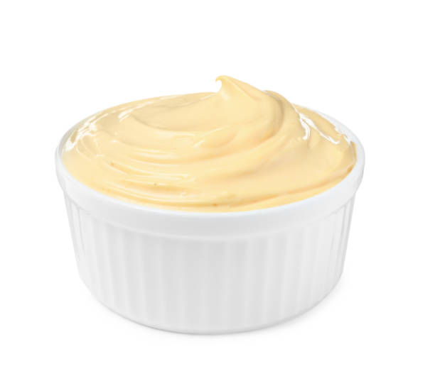 istock Tasty cheese sauce in bowl isolated on white 1456606775