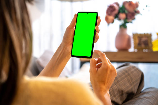 istock Close up of a mobile phone, green screen. 1456607797