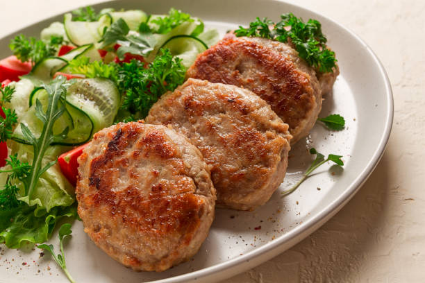 fried cutlets, turkey, with vegetable salad, top view, no people, - turkey burger imagens e fotografias de stock