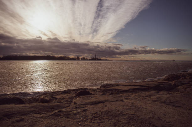 istock Chamtrail sky over river and port at sunset 1456611998