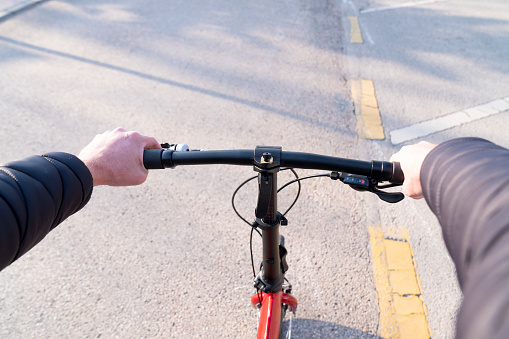 Close up of a Man's Hand Holding a Bicycle Handlebar personal perspective