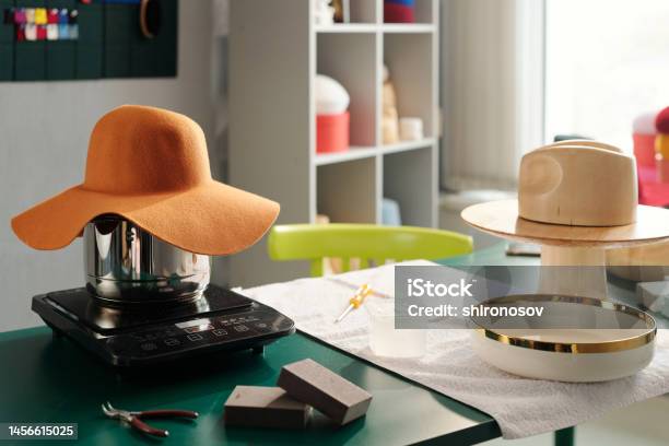 Workplace Of Modern Artisan Skilled In Creating New Trendy Hats Stock Photo - Download Image Now