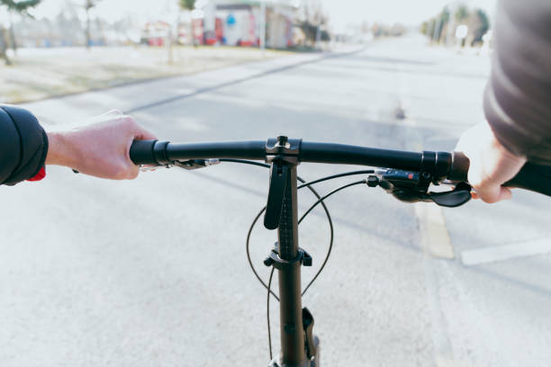 istock Close up of a Man's Hand Holding a Bicycle Handlebar personal perspective 1456616666