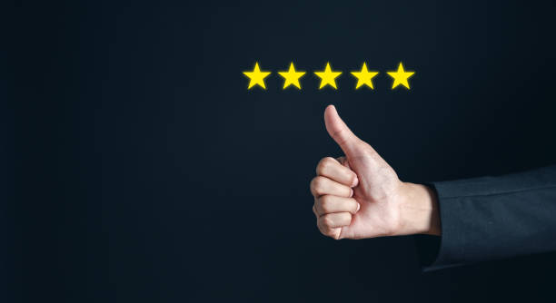 istock Customer satisfaction feedback review concept. Hand with thumb up Positive emotion happy smile face and five star with copy space. Customer service experience and business satisfaction 1456618367