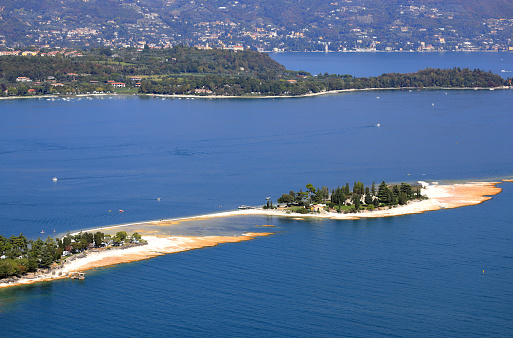 At Manerba del Garda, only a few meters from Punta Belvedere, rises a small rabit island in Lake Garda.