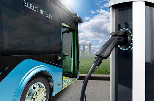 Electric bus stands at the charging station.