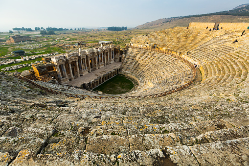 Remains of Hellenistic theatre in ancient Greek settlement of Hierapolis on sunny winter day, Pamukkale, Denizli Province, Turkey