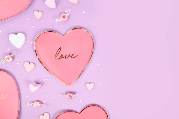 istock Pastel colored Valentine's Day flat lay with heart shaped plates 1456624707