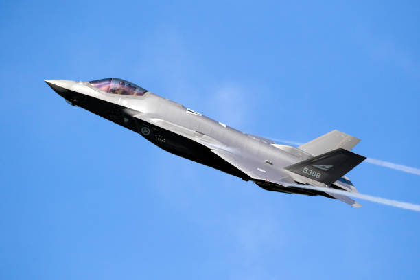 F-35 Fighter jet  approaching tanker aircraft for mid-air refueling