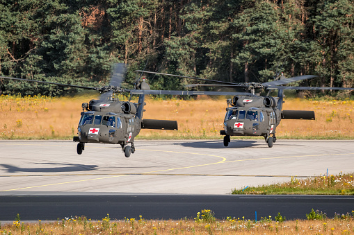 US Army Sikorsky UH-60 Blackhawk medical transport helicopters taking off from Eindhoven Air Base. Eindhoven, The Netherlands - June 22, 2018