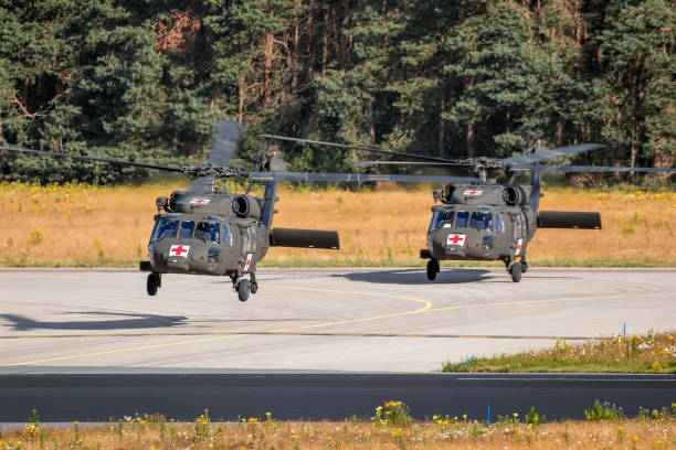 US Army Sikorsky UH-60 Blackhawk medical transport helicopters taking off from Eindhoven Air Base. The Netherlands - June 22, 2018 US Army Sikorsky UH-60 Blackhawk medical transport helicopters taking off from Eindhoven Air Base. Eindhoven, The Netherlands - June 22, 2018 blackhawk stock pictures, royalty-free photos & images