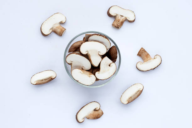 istock Fresh shiitake mushrooms on white 1456628463
