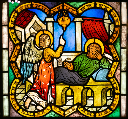 The actual title of this window is The Risen Christ.  It was purchased in 1909 from Tiffany Studios in New York.  It depicts Christ with open arms inviting the world to himself.  Produced before 1923, it is in public domain. 