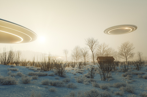 UFOs flying over winter landscape. 3D generated image.