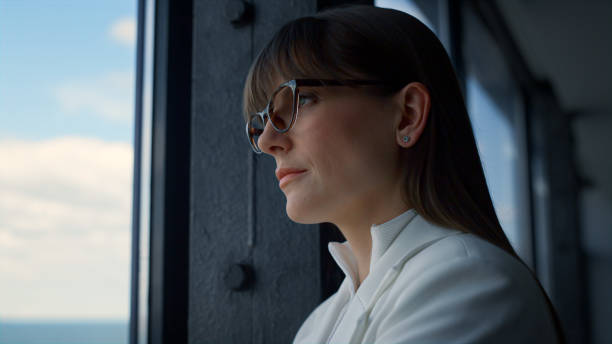 istock Portrait focused lady thinking at office window. Tired ceo manager look solution 1456634043
