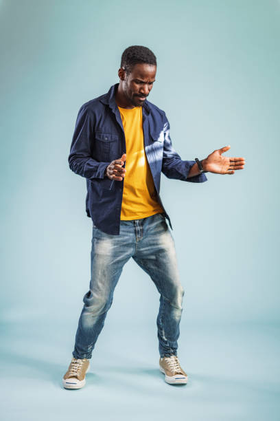 istock Confident Happy Smiling African Man Dancing And Enjoying In The Studio 1456634456