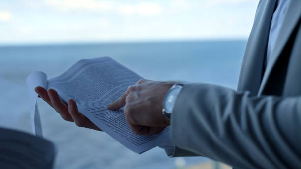 istock Closeup hands checking contract papers. Nervous client pointing legal mistakes 1456635933