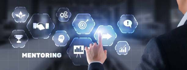 istock Businessman pressing inscription Mentoring. Training Personal development education coaching concept 1456636112